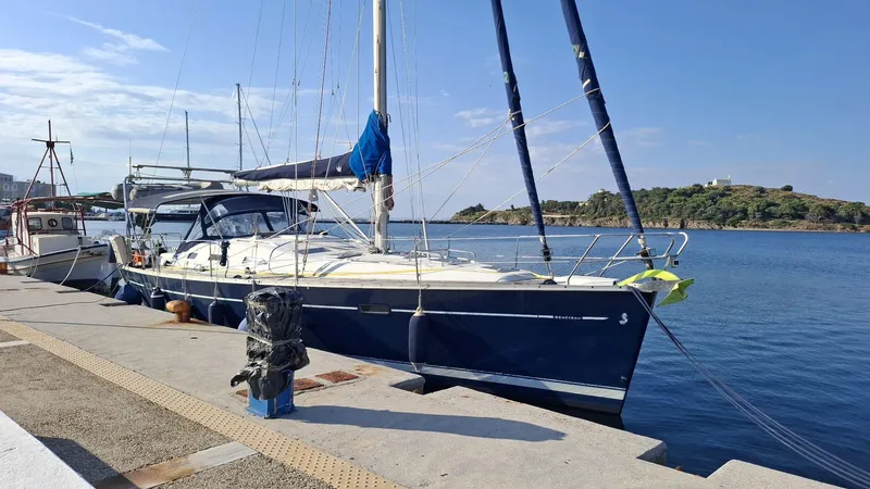  Yacht Photos Pics 2006 Beneteau Oceanis Clipper 393 yacht docked at a scenic marina.