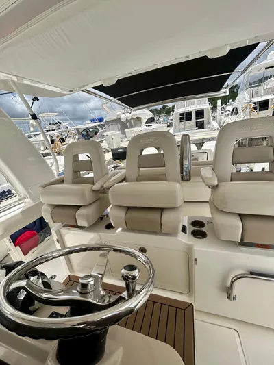  Yacht Photos Pics 2019 Boston Whaler 420 Outrage helm with luxurious seating and modern controls.