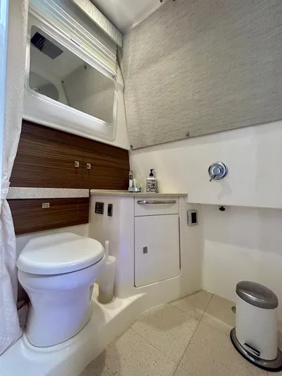  Yacht Photos Pics 2019 Boston Whaler 420 Outrage bathroom with modern fixtures and sleek design.