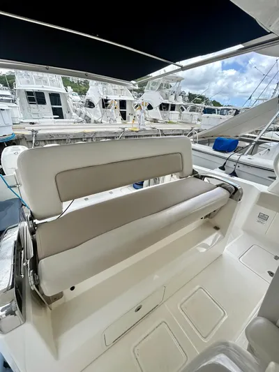  Yacht Photos Pics 2019 Boston Whaler 420 Outrage boat interior with seating, docked at marina.