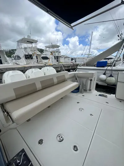  Yacht Photos Pics 2019 Boston Whaler 420 Outrage boat interior with seating, docked at marina.