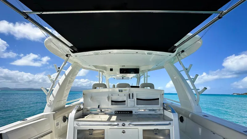  Yacht Photos Pics 2019 Boston Whaler 420 Outrage boat interior with ocean view and clear blue sky.