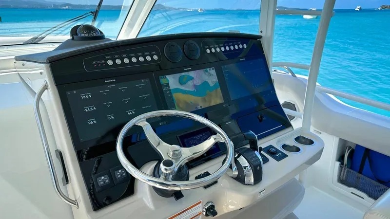  Yacht Photos Pics 2019 Boston Whaler 420 Outrage helm with advanced navigation displays and steering wheel.
