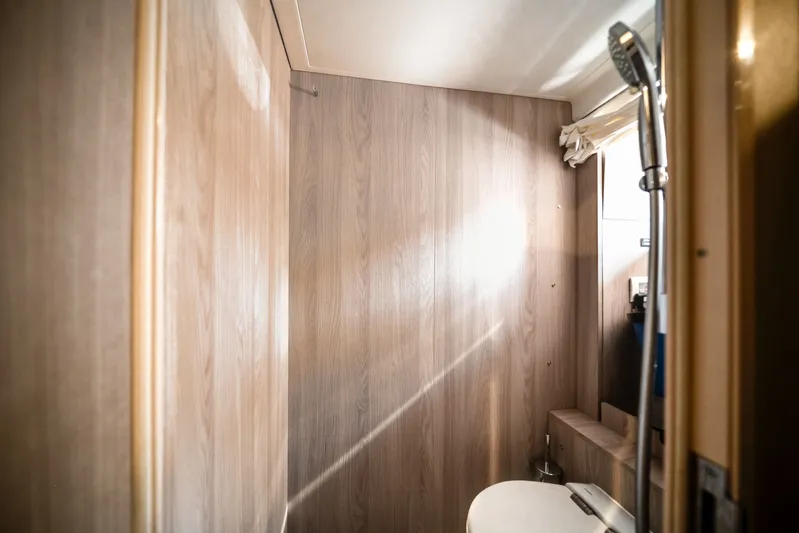  Yacht Photos Pics Interior of 2022 Azimut S7 with wood paneling and shower.