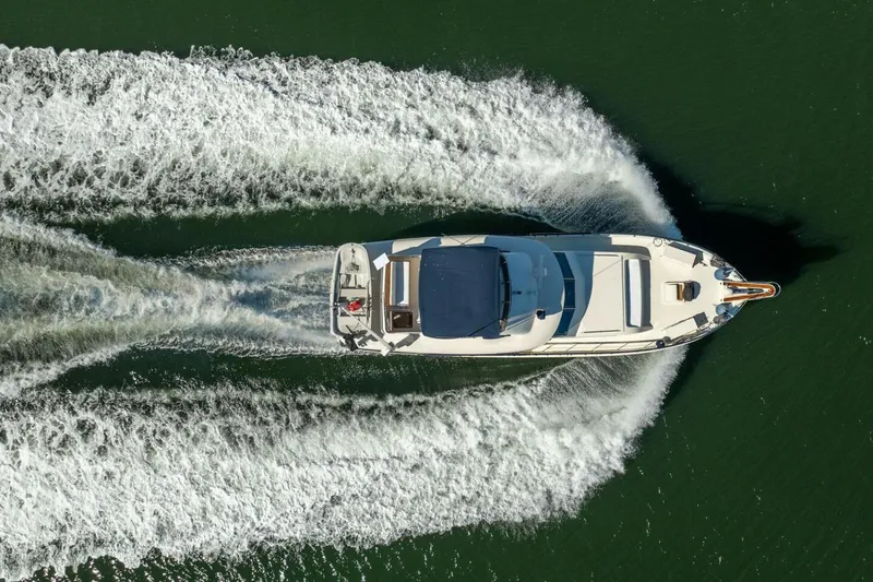 Even Keel Yacht Photos Pics Aerial view of 1985 Hatteras 53 Motor Yacht cruising on water.