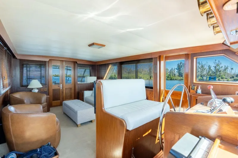 Even Keel Yacht Photos Pics Interior of 1985 Hatteras 53 Motor Yacht with leather seating and wooden accents.