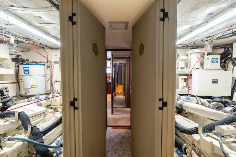 Even Keel Yacht Photos Pics Engine room of 1985 Hatteras 53 Motor Yacht, showcasing machinery and equipment.