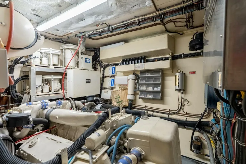 Even Keel Yacht Photos Pics Engine room of 1985 Hatteras 53 Motor Yacht with mechanical components and wiring.