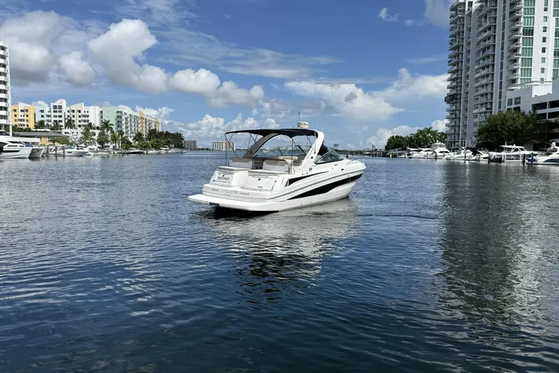  Yacht Photos Pics 2015 Sea Ray 370 Venture yacht cruising in a scenic urban marina.