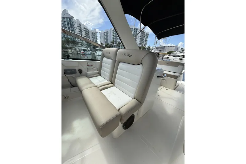  Yacht Photos Pics 2015 Sea Ray 370 Venture boat interior with beige seating and marina view.