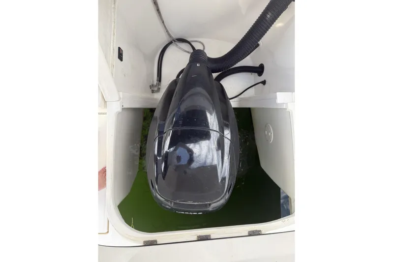  Yacht Photos Pics Engine compartment of a 2015 Sea Ray 370 Venture boat, featuring a black engine cover.