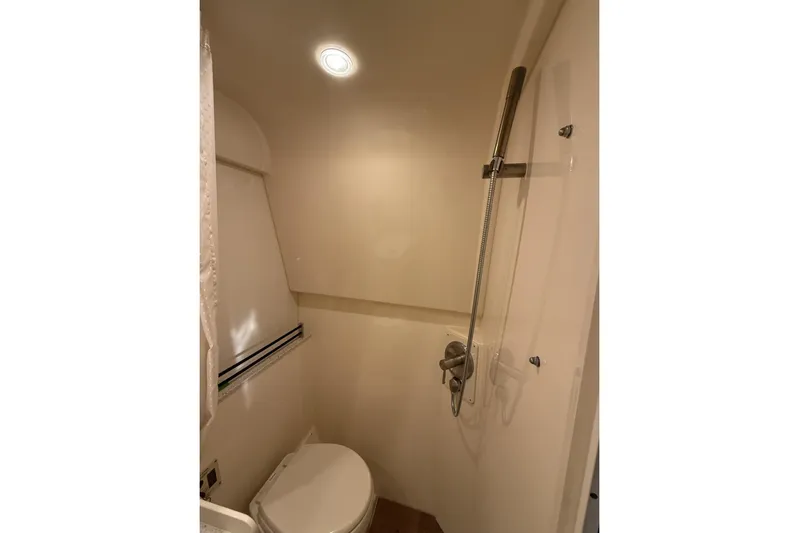  Yacht Photos Pics Bathroom interior of 2015 Sea Ray 370 Venture yacht with shower and toilet.