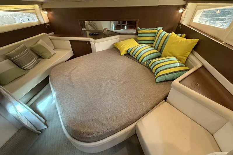  Yacht Photos Pics Luxurious cabin interior of 2015 Sea Ray 370 Venture with cozy bedding and stylish cushions.