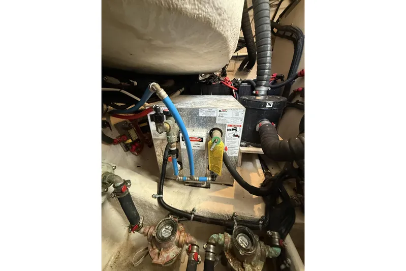  Yacht Photos Pics Engine compartment of 2015 Sea Ray 370 Venture with various hoses and components.