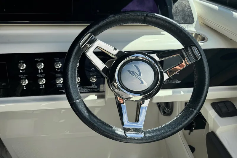  Yacht Photos Pics Steering wheel of 2019 Sea Ray 310 SLX boat with control panel.