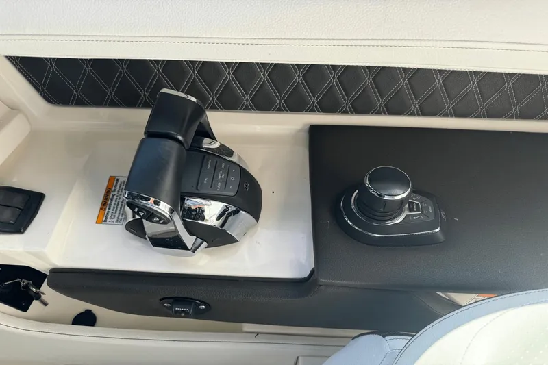  Yacht Photos Pics Control panel of a 2019 Sea Ray 310 SLX boat with joystick and throttle.