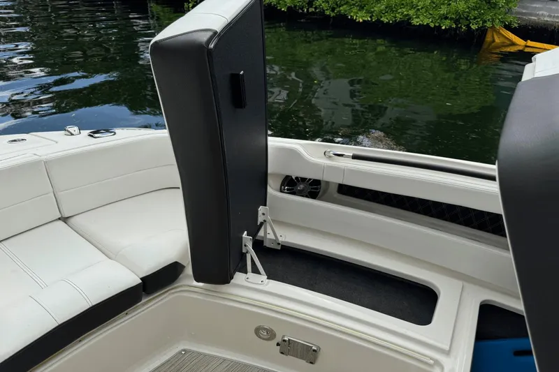  Yacht Photos Pics 2019 Sea Ray 310 SLX boat interior with white seating and black accents near water.