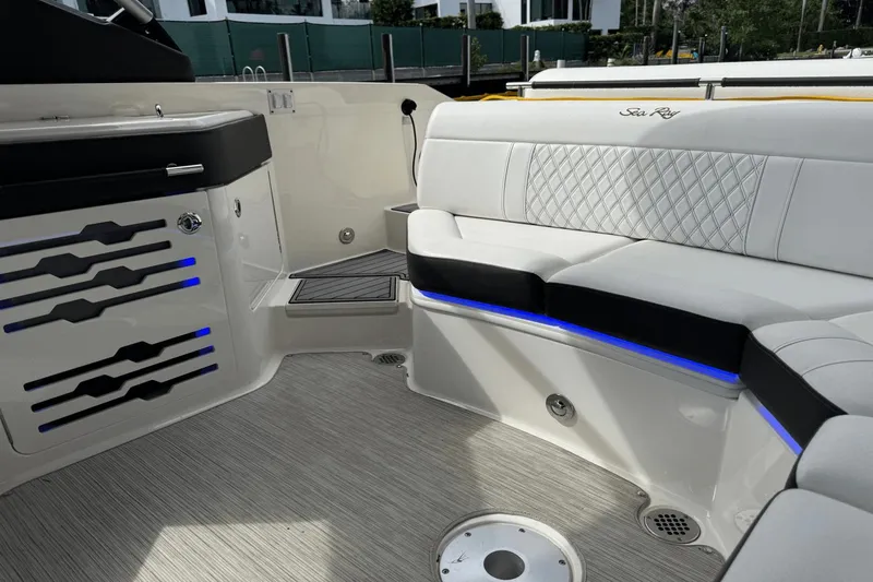  Yacht Photos Pics Luxurious interior of 2019 Sea Ray 310 SLX boat with elegant seating and ambient lighting.