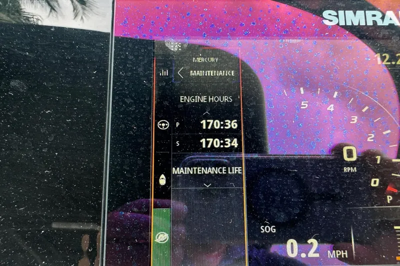  Yacht Photos Pics Display screen of 2019 Sea Ray 310 SLX showing engine hours and maintenance data.
