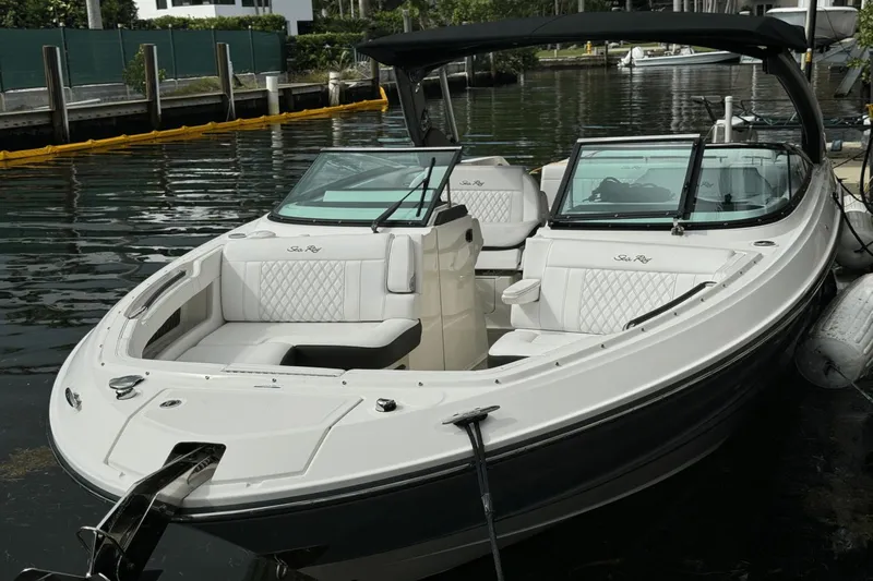  Yacht Photos Pics 2019 Sea Ray 310 SLX boat docked, featuring sleek design and luxurious seating.