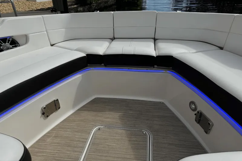  Yacht Photos Pics 2019 Sea Ray 310 SLX boat interior with white seating and blue LED lighting.