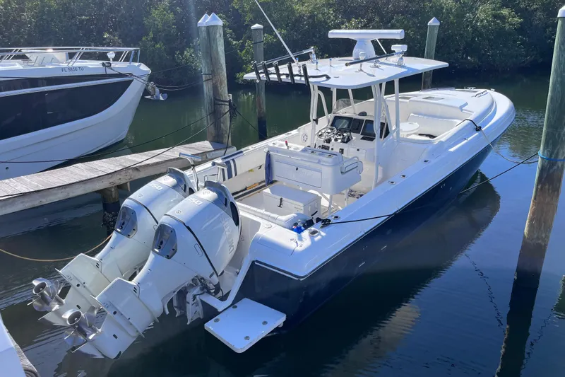  Yacht Photos Pics 2008 Intrepid 370 Cuddy boat docked with dual outboard engines.