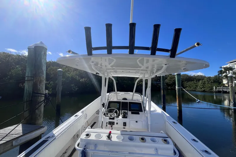  Yacht Photos Pics 2008 Intrepid 370 Cuddy boat docked under clear blue sky.
