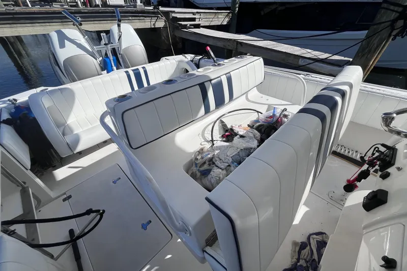  Yacht Photos Pics 2008 Intrepid 370 Cuddy boat interior with white seating and storage area.