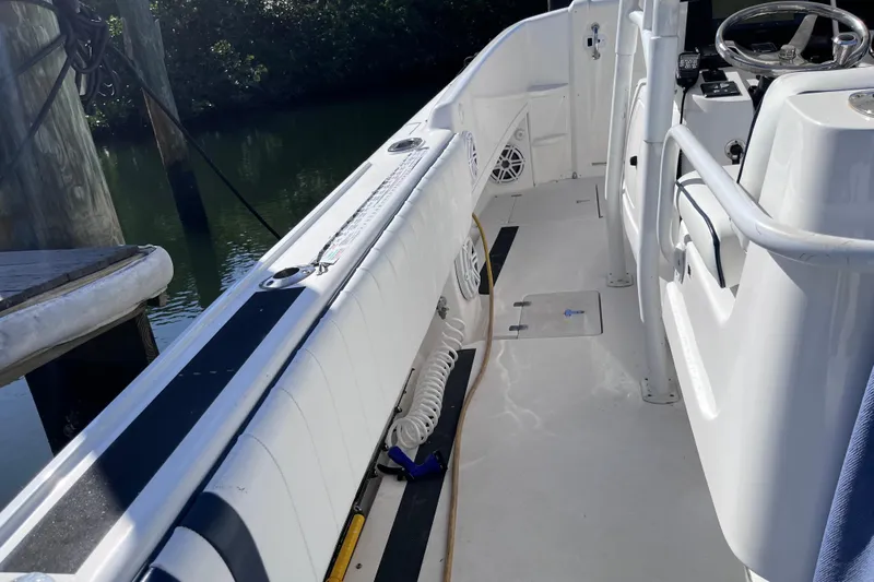  Yacht Photos Pics 2008 Intrepid 370 Cuddy boat interior with steering wheel and seating area.