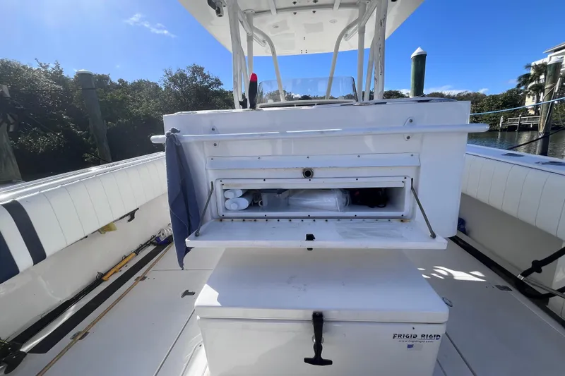  Yacht Photos Pics 2008 Intrepid 370 Cuddy boat interior with storage compartment and seating area.