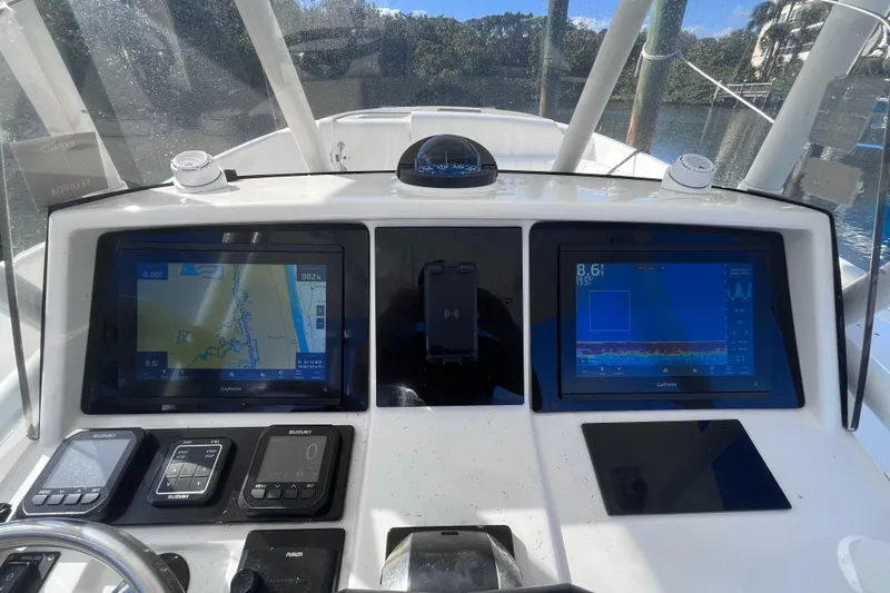  Yacht Photos Pics Dashboard of a 2008 Intrepid 370 Cuddy with navigation and control systems.