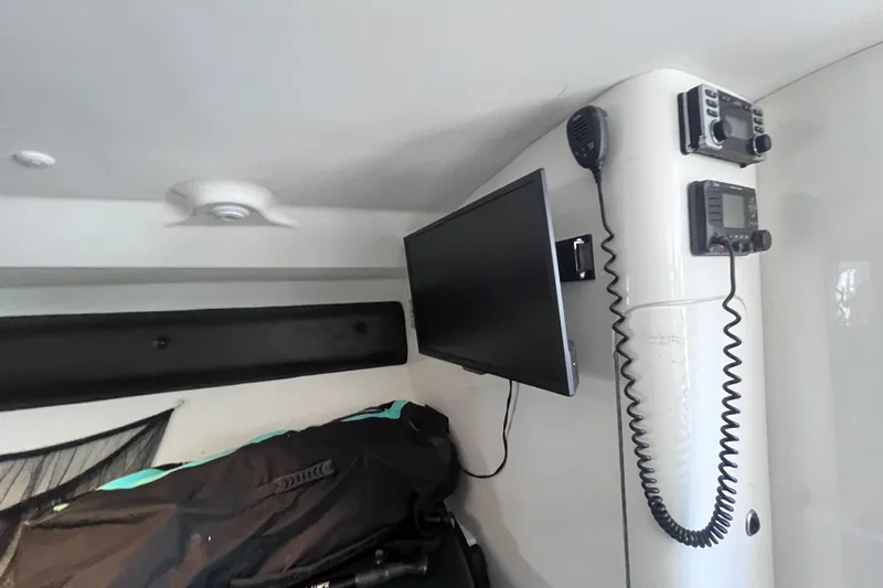  Yacht Photos Pics Interior of 2008 Intrepid 370 Cuddy with mounted electronics and storage area.