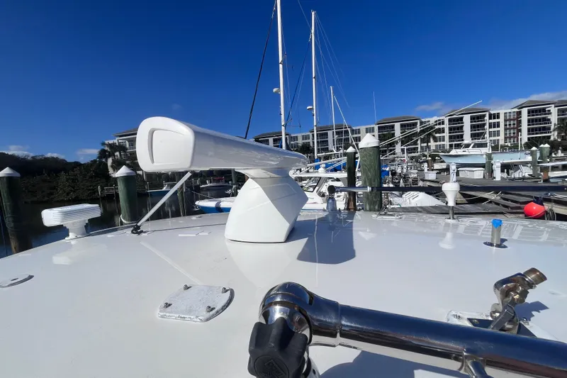  Yacht Photos Pics 2008 Intrepid 370 Cuddy boat docked at marina with clear blue sky.