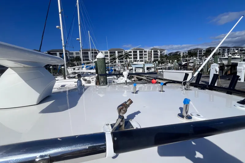  Yacht Photos Pics 2008 Intrepid 370 Cuddy boat deck at marina, clear blue sky background.