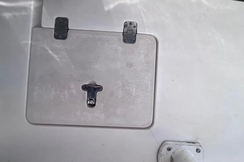  Yacht Photos Pics Hatch on 2008 Intrepid 370 Cuddy boat, featuring metal latch and hinges.