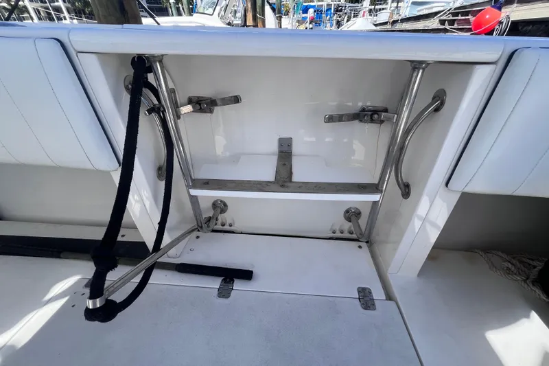  Yacht Photos Pics 2008 Intrepid 370 Cuddy boat interior with stainless steel fittings and white seating.