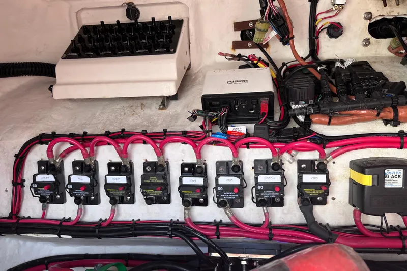  Yacht Photos Pics Electrical panel of a 2008 Intrepid 370 Cuddy boat with circuit breakers and wiring.