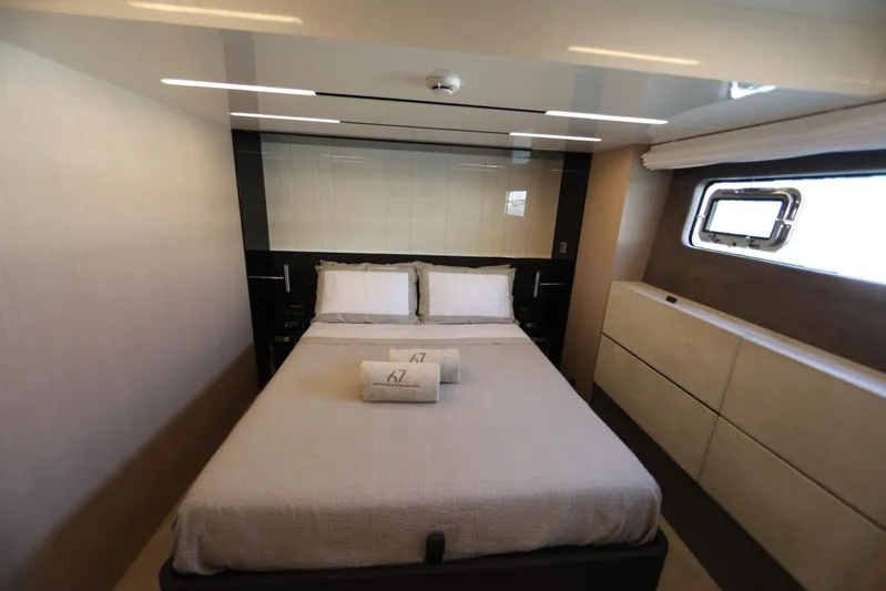 Yacht Photos Pics Luxurious bedroom interior of Cranchi Sessantasette 67 yacht, 2024 model, featuring modern design.