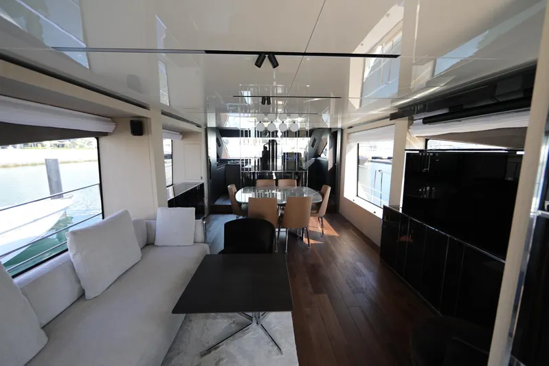  Yacht Photos Pics Luxurious interior of 2024 Cranchi Sessantasette 67 yacht with modern dining area.
