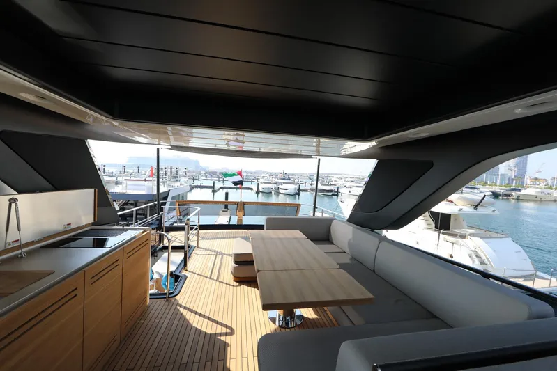  Yacht Photos Pics Luxurious interior of 2024 Cranchi Sessantasette 67 yacht with modern seating and ocean view.