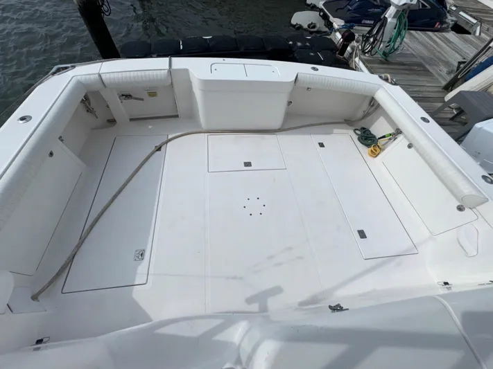 Land Ho Yacht Photos Pics 2007 Cabo 40 Express boat deck, spacious and clean, docked at marina.