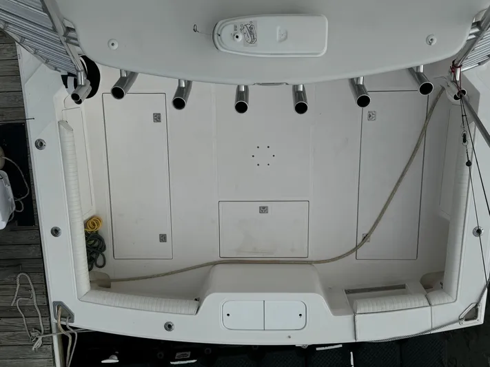 Land Ho Yacht Photos Pics Overhead view of 2007 Cabo 40 Express boat deck with rod holders and storage compartments.