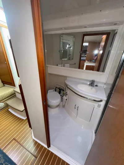 Land Ho Yacht Photos Pics Bathroom interior of 2007 Cabo 40 Express yacht, featuring sink and toilet.