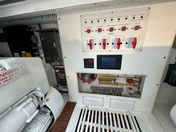 Land Ho Yacht Photos Pics Electrical control panel of a 2007 Cabo 40 Express boat, featuring switches and wiring.