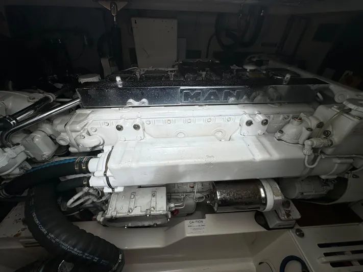 Land Ho Yacht Photos Pics Engine compartment of a 2007 Cabo 40 Express boat, featuring a MAN engine.
