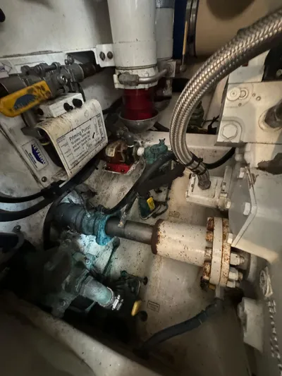 Land Ho Yacht Photos Pics Engine room of 2007 Cabo 40 Express boat, showcasing mechanical components and piping.