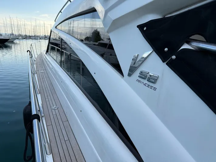  Yacht Photos Pics 2009 Princess V58 yacht docked, showcasing sleek design and branding.