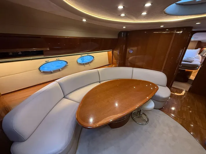  Yacht Photos Pics Luxurious 2009 Princess V58 yacht interior with elegant seating and wooden table.