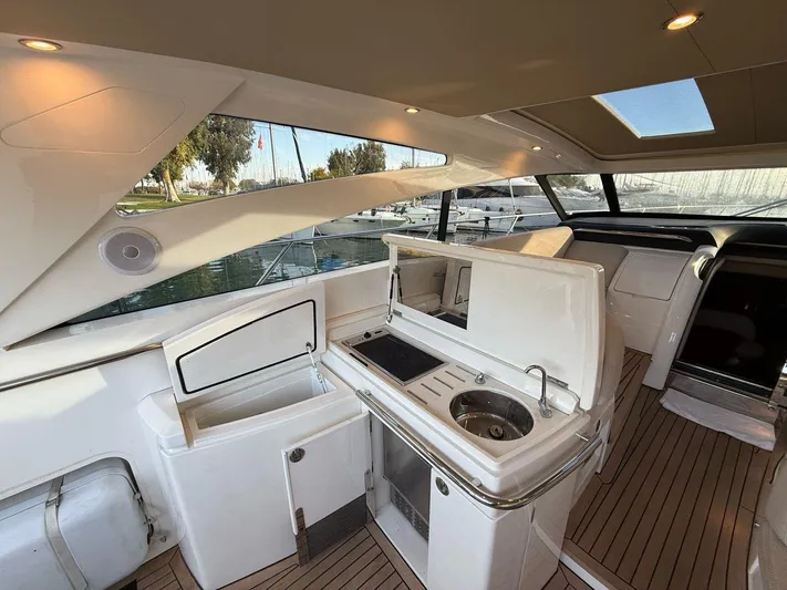  Yacht Photos Pics Luxurious 2009 Princess V58 yacht interior with sleek kitchen and modern amenities.