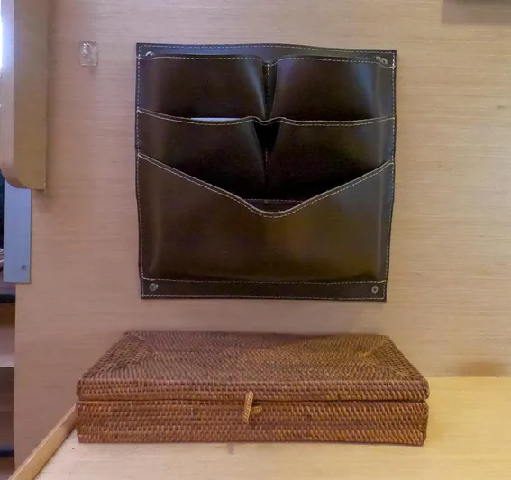 Bleu Lagoon Yacht Photos Pics Wall-mounted leather organizer and woven box in Lagoon 421, 2012 model interior.